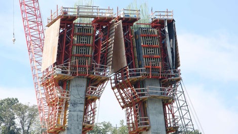 The two diamond shaped pylon towers are 320’ high