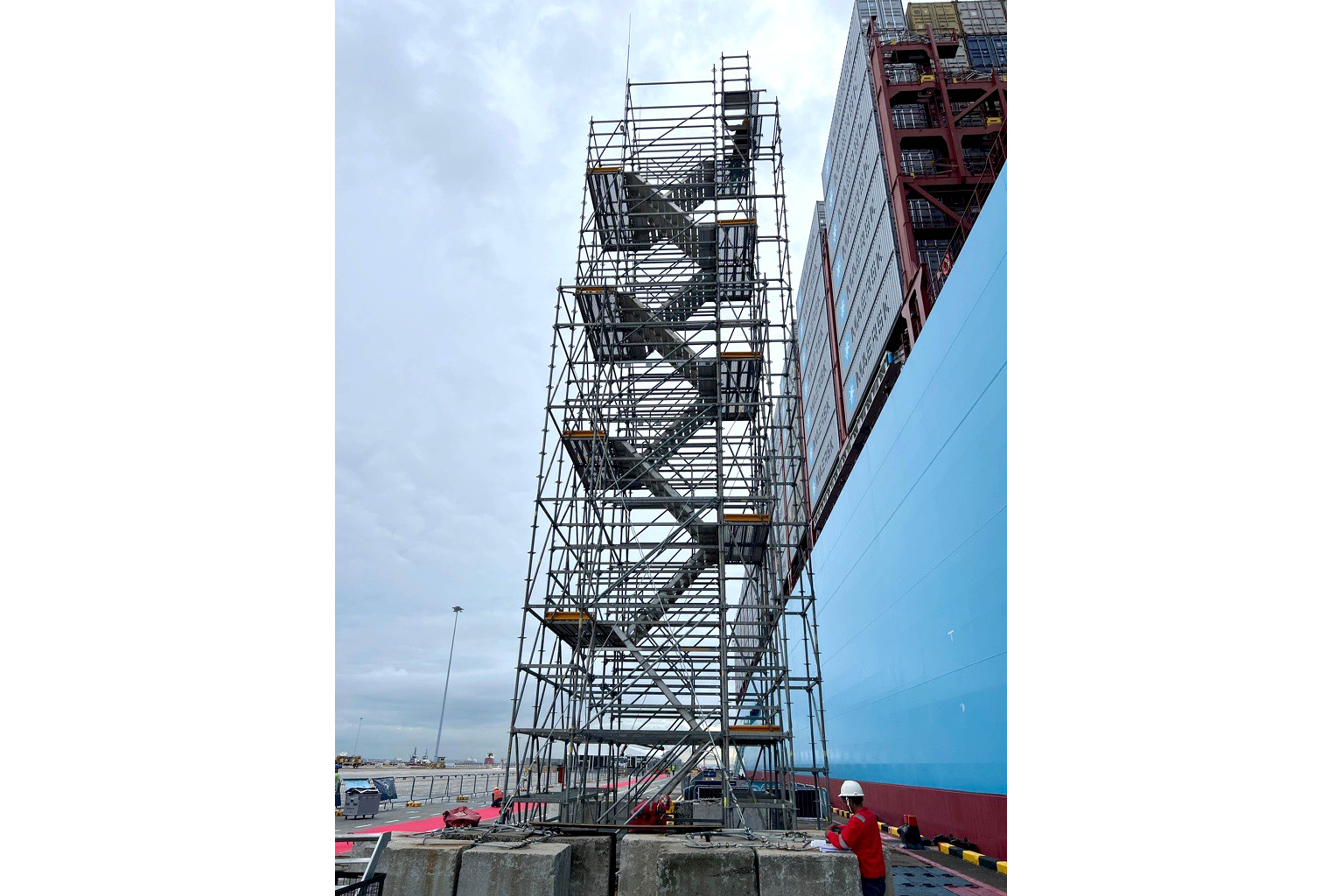 As there were no existing structures at site to brace and secure the 18 meter-high stair tower, guy wires were tied to counter weights at the base to secure tower
