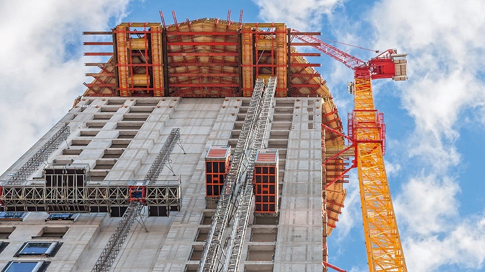 For constructing the barrel-shaped section of the Henninger Turm, a cantilevered working and scaffolding platform up to 8 m long was formed at a height of 100 m on the basis of rentable standard system components in 100 m height.