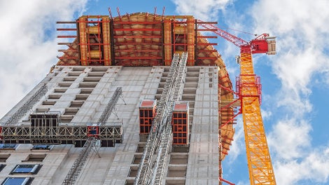 For constructing the barrel-shaped section of the Henninger Turm, a cantilevered working and scaffolding platform up to 8 m long was formed at a height of 100 m on the basis of rentable standard system components in 100 m height.
