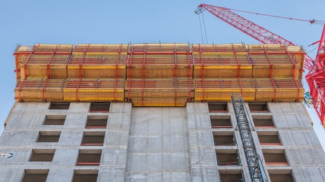 RCS and TRIO formed rail-guided climbing formwork units for the re-created north side of the former grain storage silo.