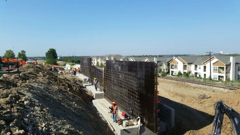 Retaining walls being formed at iron horse station