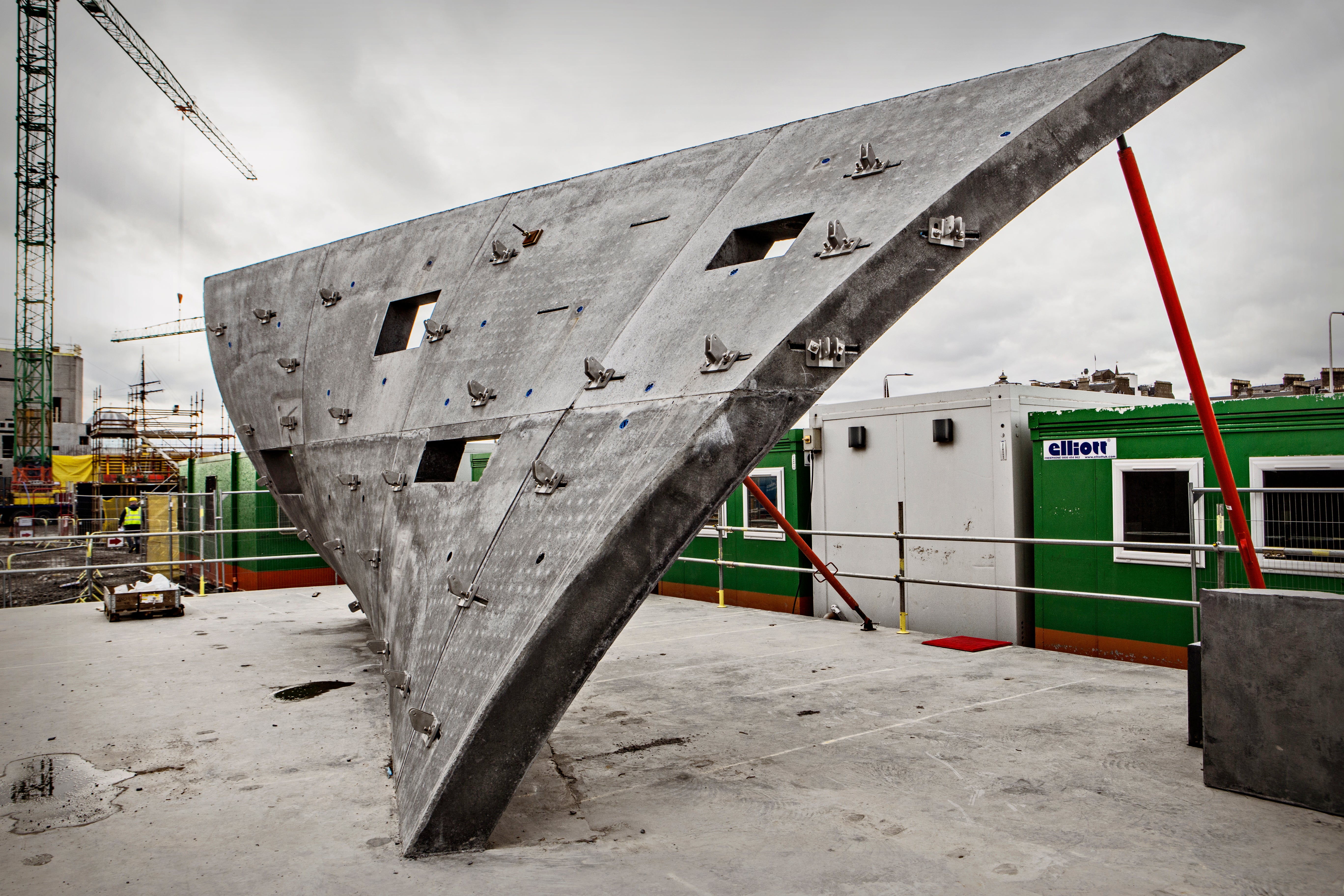 Before the main construction had started, a full-size sample panel with reverse curvature and slope was constructed on site.