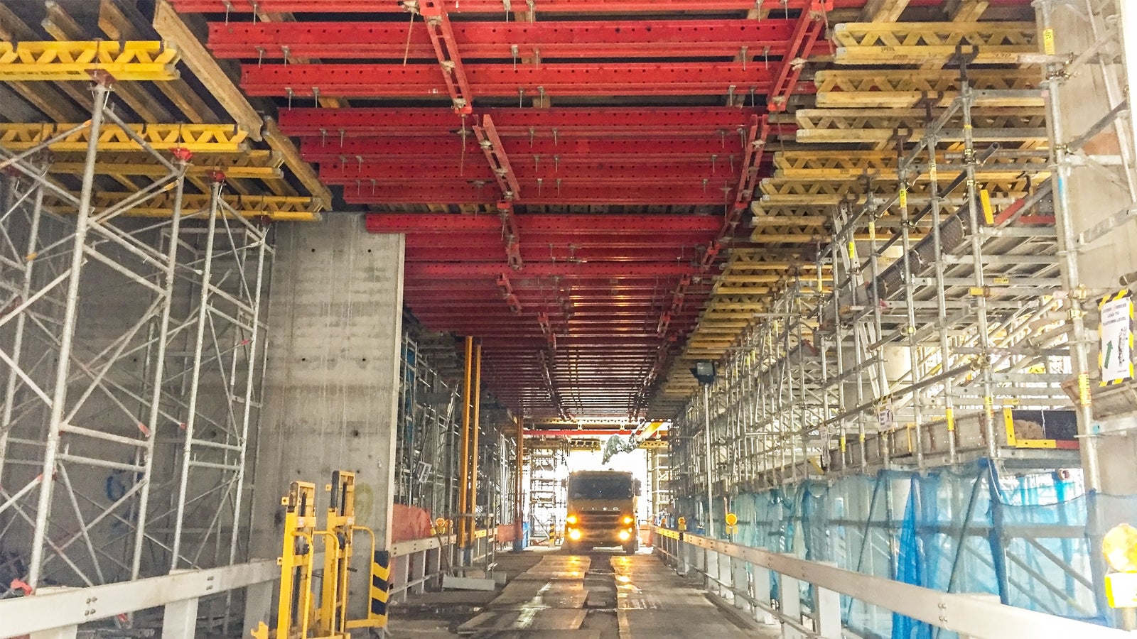 PERI UP Flex with Table Top are used to build up the logistic corridor for vehicle to gain access to transport soil from the basement.