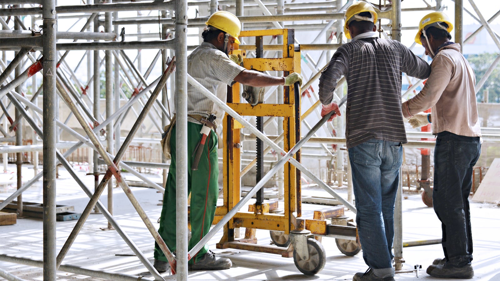 Workers are using the Trolley and Winch Unit for an easy horizontal movement.