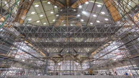 Movable platforms with 25 m spans provide safe working areas for different tasks to be carried out on the the underside of a railway station roof.