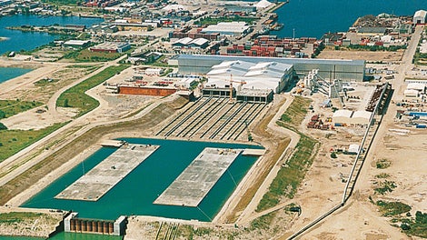The two 176 m long and 57,000 t tunnel sections swimming in the flooded dry docks, ready to be towed out.