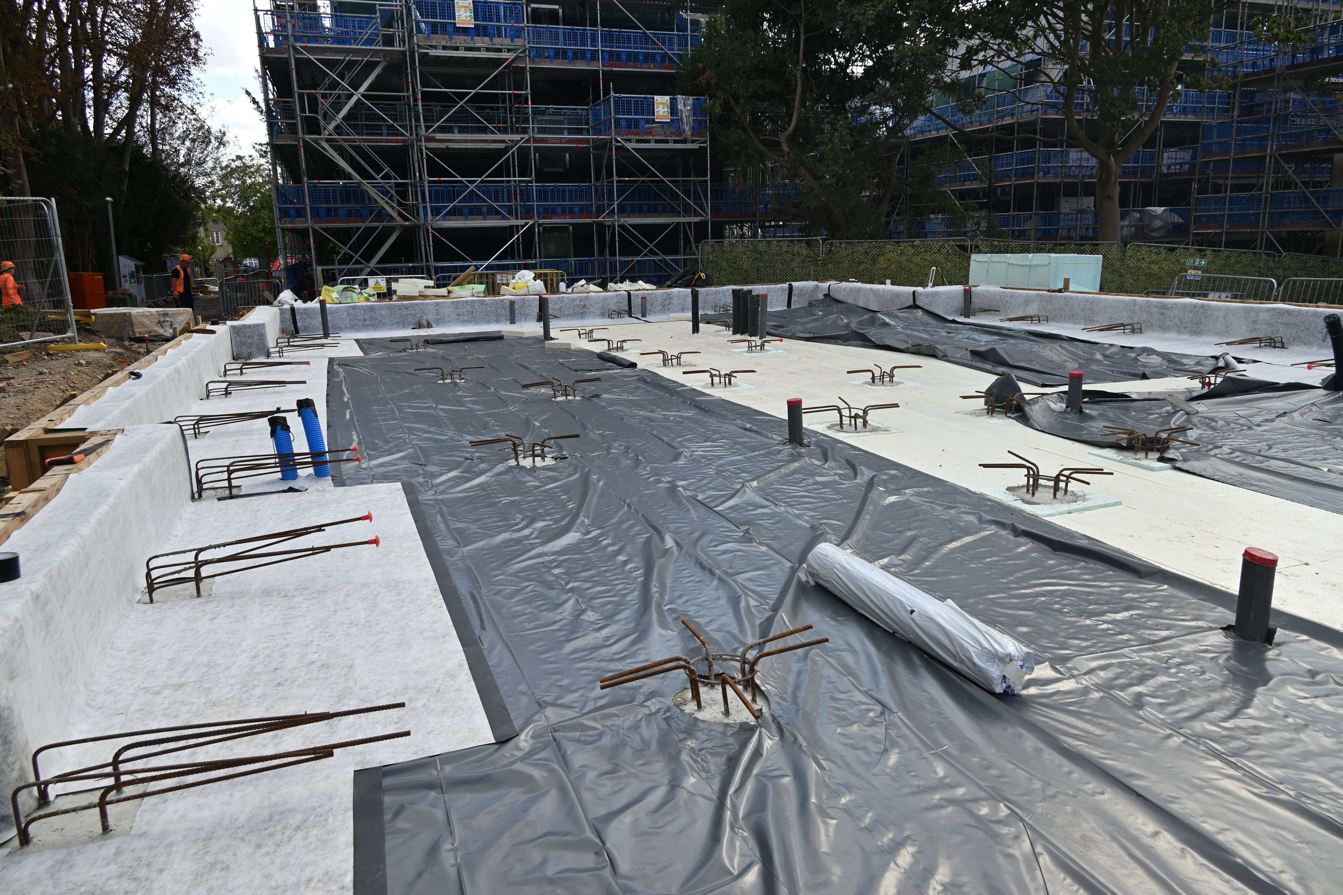 Waterproof membrane being applied to prevent moisture penetration as part of the PERI UK waterproofing solution.