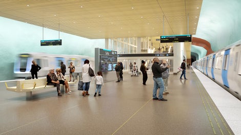 Rulltrappor leder från plattformen till mellanplan där resenärer kliver på någon av de åtta snabbhissarna.<br/><br/>Visionsbild: Region Stockholm/Sweco