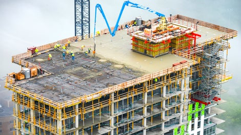 The formworks were configured to be self-climbing and suspended above the slab, ensuring the walls could be poured the same day as the slab.