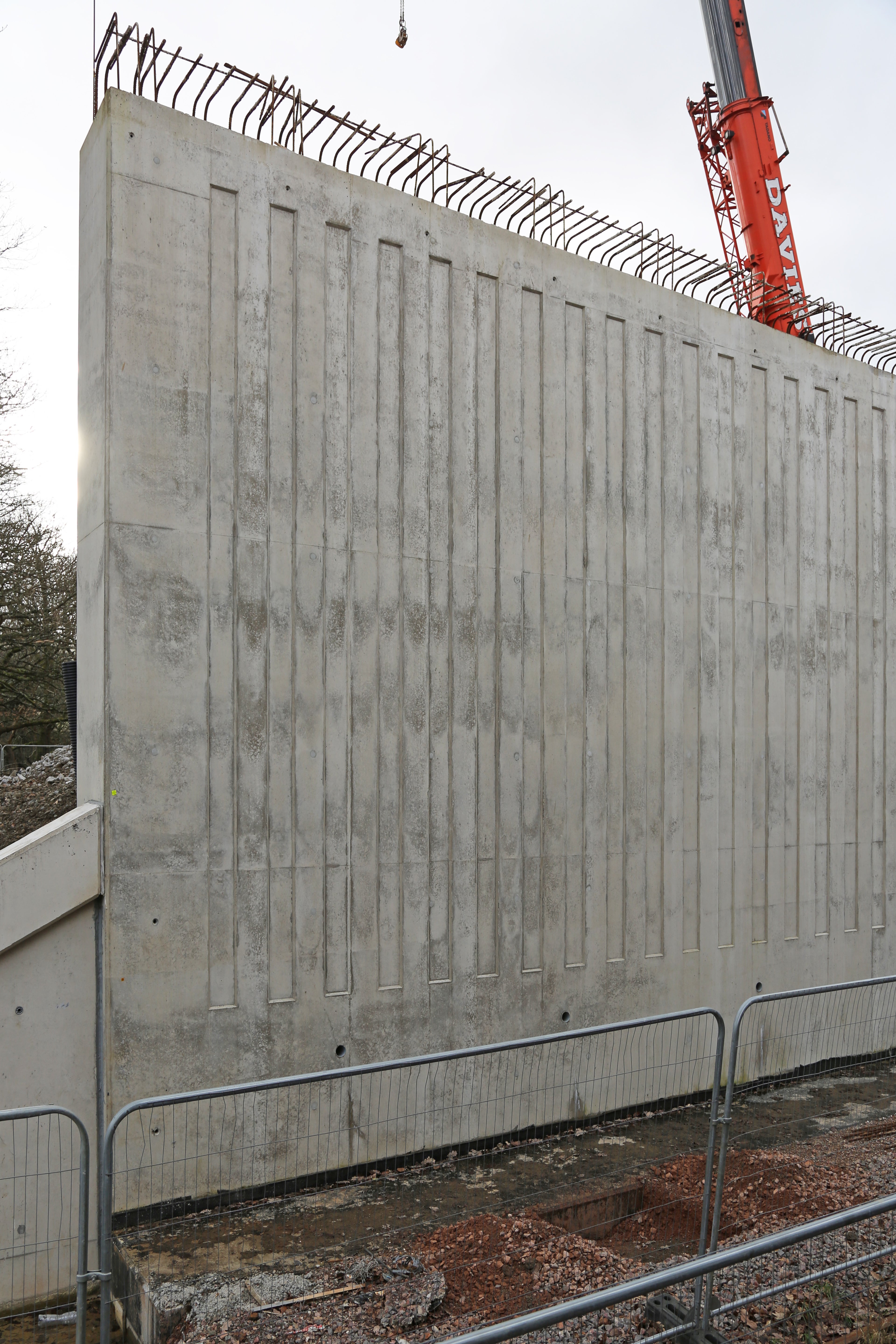 Architectural finishes like this fluted design are visible across the project.