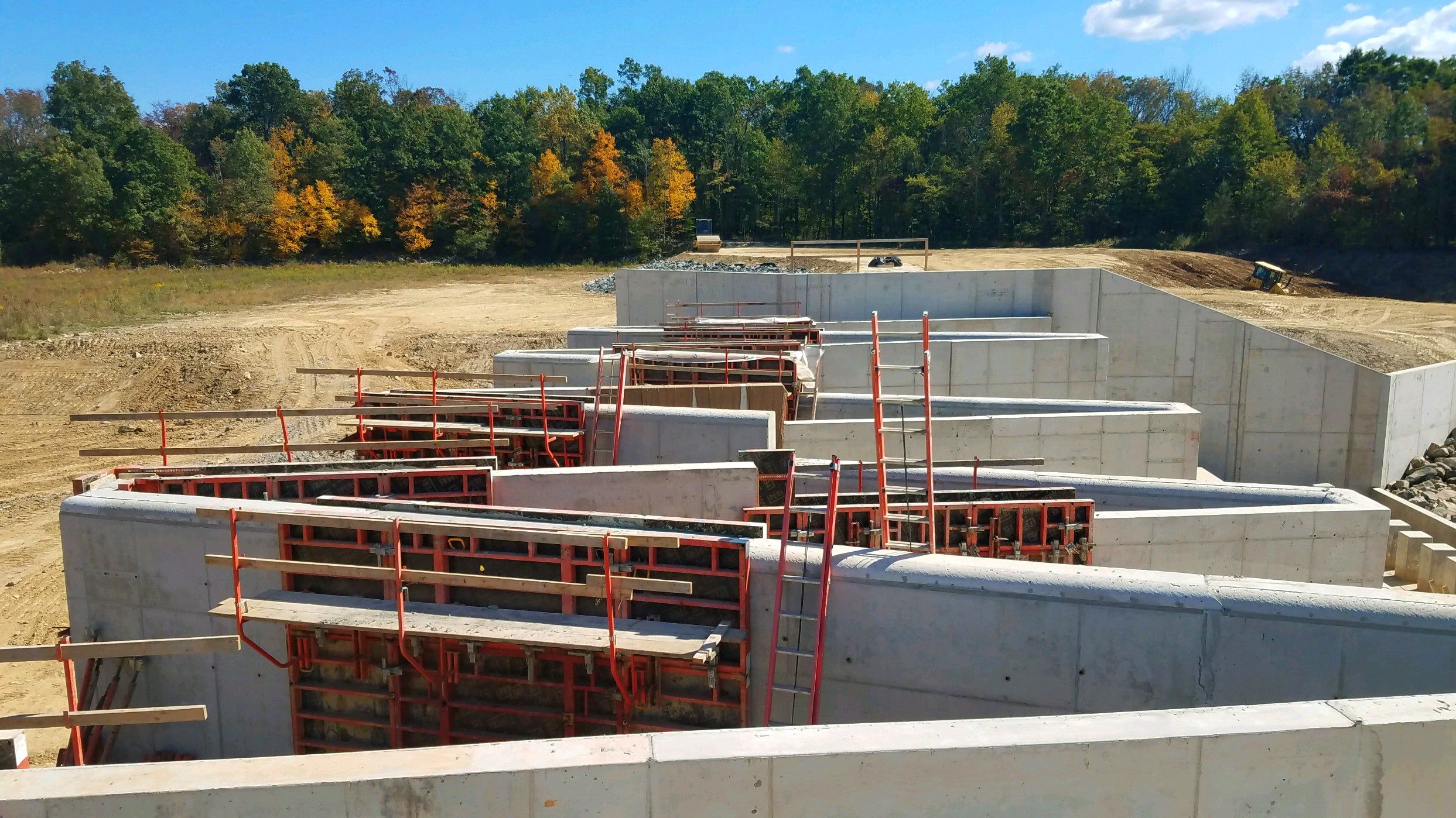 Intensifying storms caused flooding, requiring repairs to the spillway and dam. 