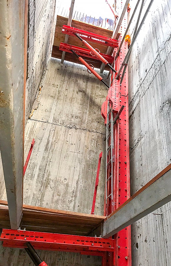 Internal shaft platform with an opening for installation of the pre-cast stair flights.