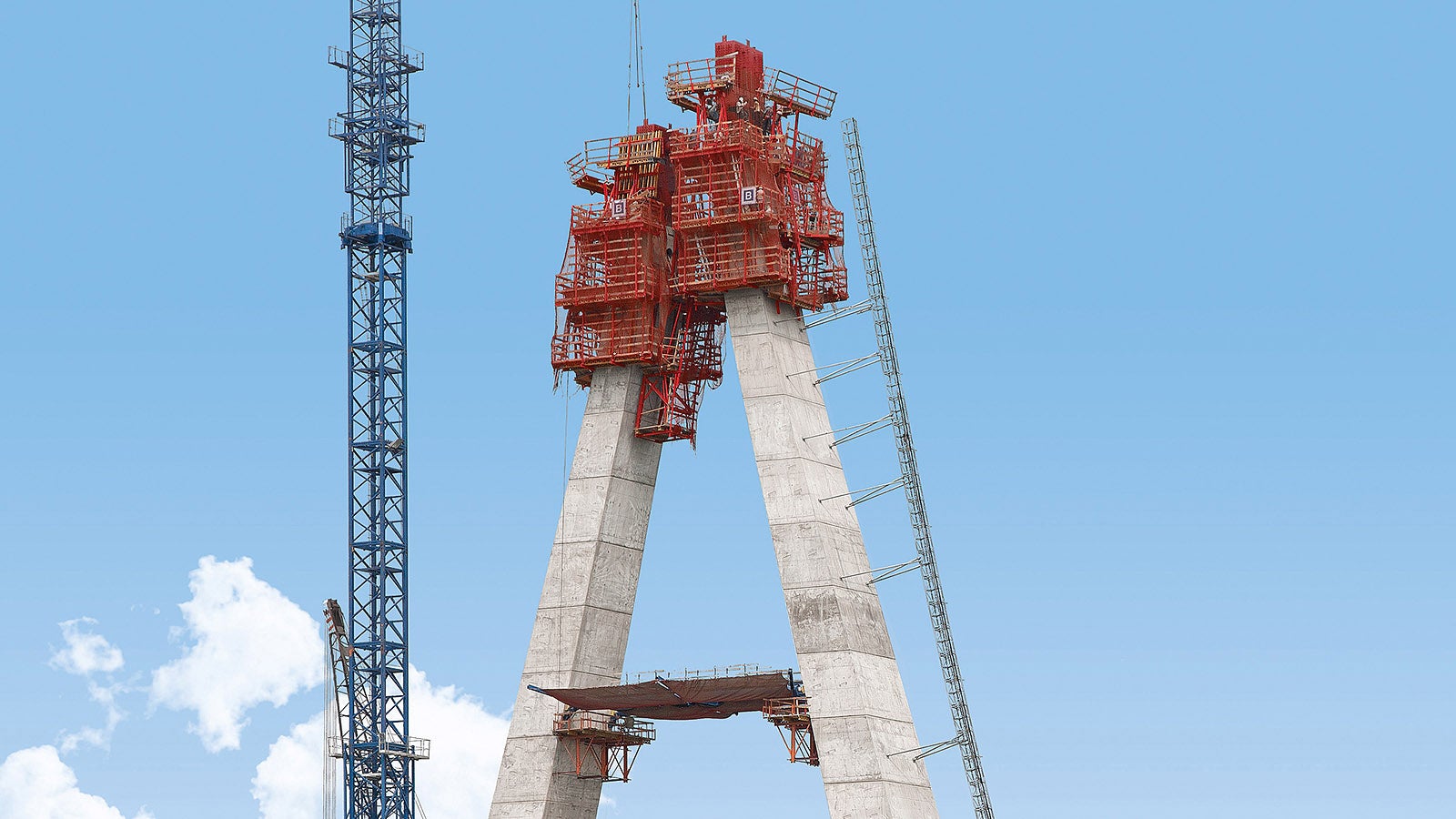The 90 m high pylon with complex geometry carries the 225 m long main bridge section.