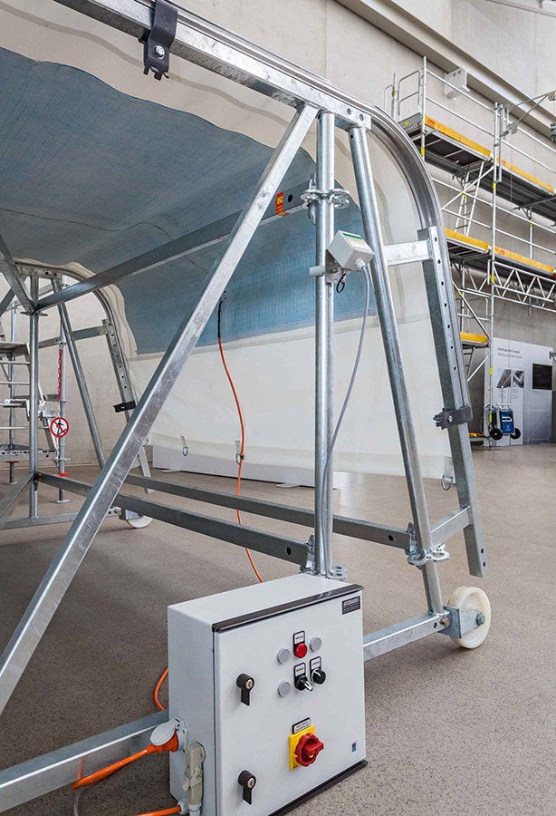 A sheeting which can be heated ensures that neither ice nor snow can accumulate on the weather protection roof. Such a solution eliminates not only the work required for clearing off the snow. In addition, the width and span can be increased when the roof is constantly free of snow which in turn brings time and cost savings.