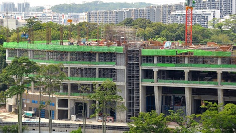 3 V-shape columns (bottom right) casted with VARIO GT 24 Girderwall Formwork with heights ranging from 5.5m to 11.5m