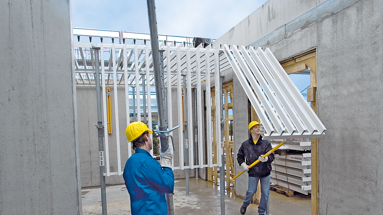 Safe shuttering procedure by swivelling the panels upwards with site personnel positioned on the slab below.