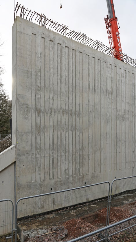 Architectural finishes like this fluted design are visible across the project.