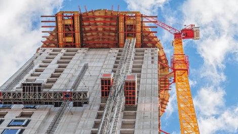 For constructing the barrel-shaped section of the Henninger Turm, a cantilevered working and scaffolding platform up to 8&nbsp;m long was formed at a height of 100&nbsp;m on the basis of rentable standard system components in 100&nbsp;m height.