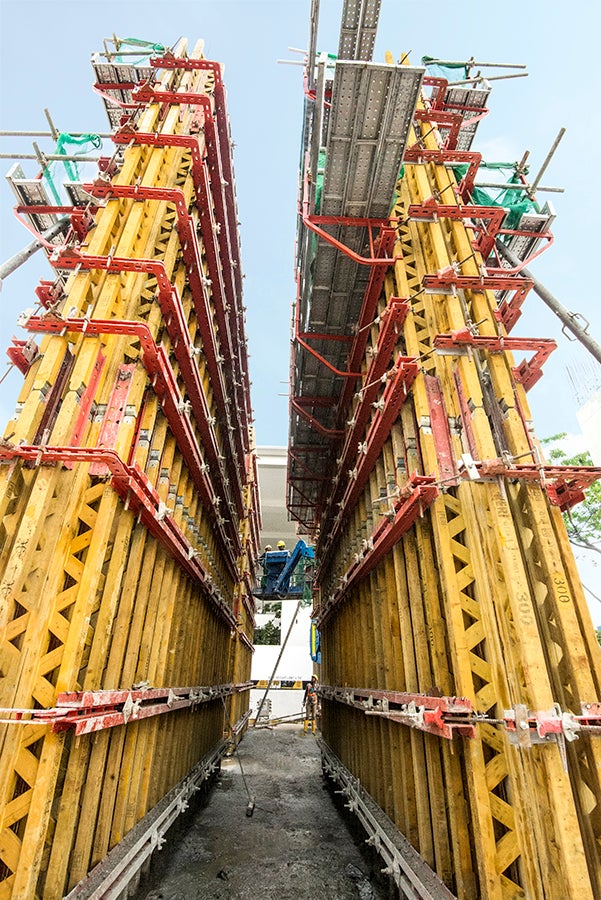 Workers are erecting the panels after they have successful cast the wall.